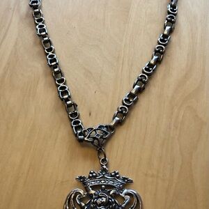 Ornate Silver-Tone Crest Pendant Necklace
